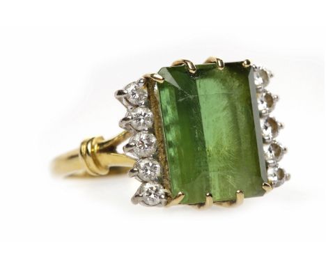 TOURMALINE AND DIAMOND RINGthe rectangular step cut tourmaline 13x10mm and flanked by two rows of round brilliant cut diamond