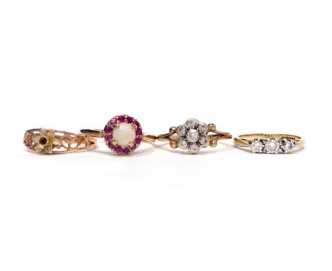 FOUR GOLD RINGScomprising a nine carat gold opal and ruby cluster ring, size Q-R, 2.8g; a nine carat gold diamond three stone