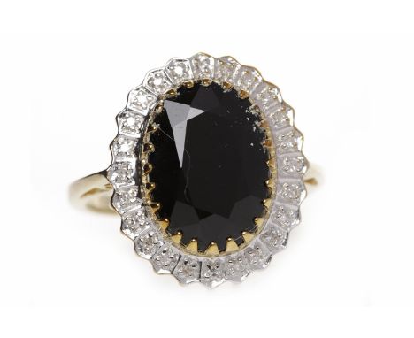 NINE CARAT GOLD SAPPHIRE AND DIAMOND RINGthe central oval dark sapphire 13.8mm long and within a grain set diamond border, si