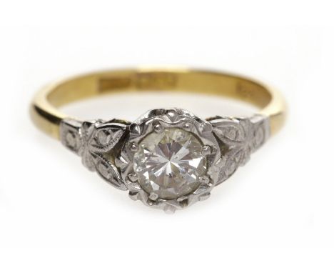 MID TWENTIETH CENTURY DIAMOND SOLITAIRE RINGwith an illusion set round brilliant cut diamond of approximately 0.33 carats in 