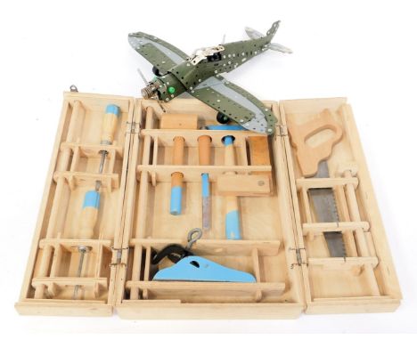 A kit built metal model Spitfire, 37cm wide, together with a cased miniature tool kit. 