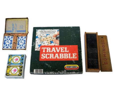 Various toys and games, comprising travel Scrabble, cased dominoes, and two sets of playing cards. 