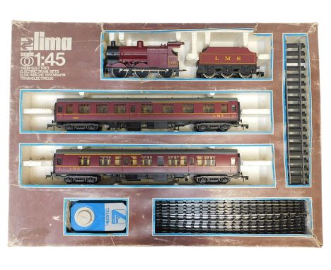 Lima O gauge electric train set, including class 4F locomotive 0-6-0 in LMS crimson, first class coach 15865, and a first cla