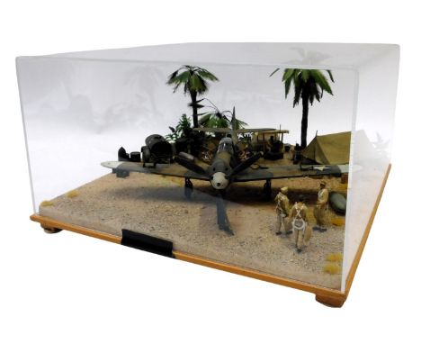 A cased World War II diorama diecast model plane, the Air Cobra P-38, circa 1942, 1-32 scale, 22cm high, 39cm wide, 39cm deep