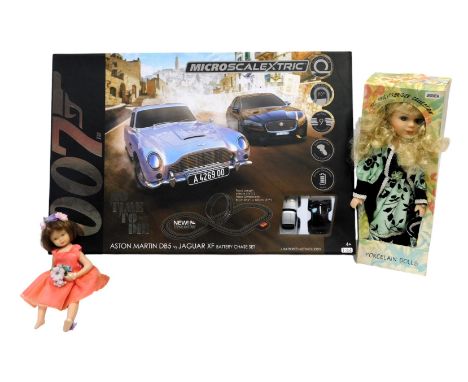 A Micro James Bond 007 No Time To Die Scalextric set, and two Knightsbridge Collection dolls. (3)