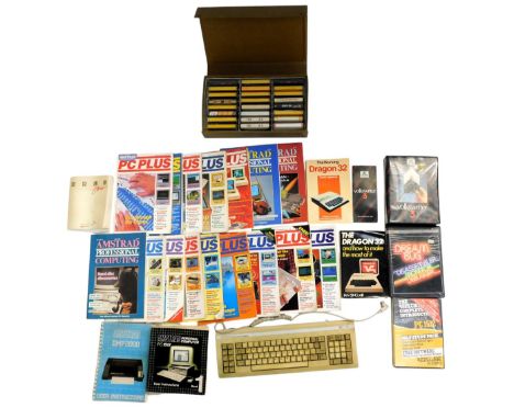 An Amstrad personal computer, hard drive and keyboard, various Amstrad books and games. (a quantity) 