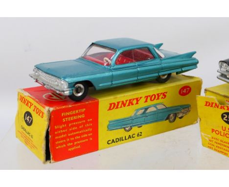 Dinky - A pair of diecast Dinky vehicles to include #258 U.S.A Police Car andd #147 Cadillac 62. Items show signs of light us