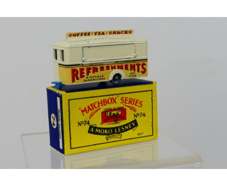 Matchbox - A boxed Mobile Canteen Refreshments Bar in cream with light blue base and grey plastic wheels # 74. The model appe