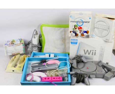 Nintendo - Wii - Sony - Playstation - A Wii Console with some accessories and a Sony Playstation. Includes 7 x boxed games an