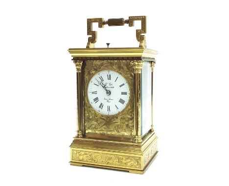 Good contemporary carriage clock striking on a gong, the 2.5" white dial signed L'Epee... within an engraved gilt mask and en