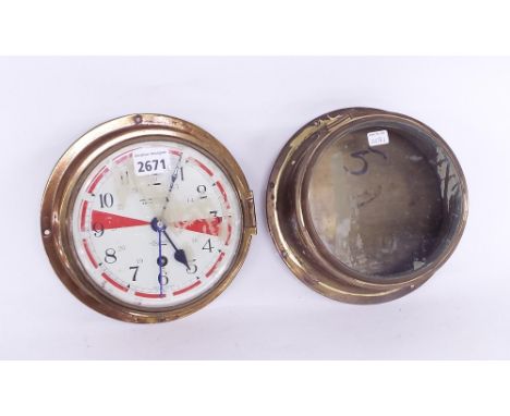 Sestrel brass bulkhead ship's clock, the 5.5" white and red painted dial inscribed Henry Browne & Son Limited, Barking & Lond