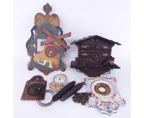 Small Black Forest cuckoo clock in the form of a gabled house, three German clock faces and two Black Forest clock weights