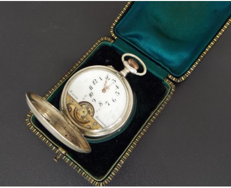 Hebdomas eight day silver hunter pocket watch, the white dial with Arabic numerals over the visible balance within an engine 