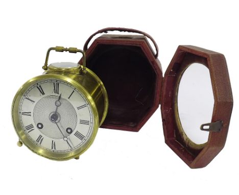 Brass drumhead two train carriage type clock striking on a bell, the 3.75" silvered dial with engine turned centre within a d