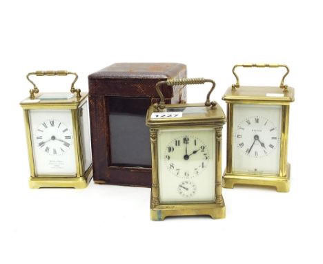 Carriage clock timepiece with alarm, the principal dial above a subsidiary alarm dial within a corniche brass case and Morocc