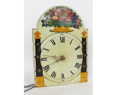 Black Forest shield wall clock, the 12" painted wooden dial with Roman numerals, surmounted by a bouquet of flowers, with woo