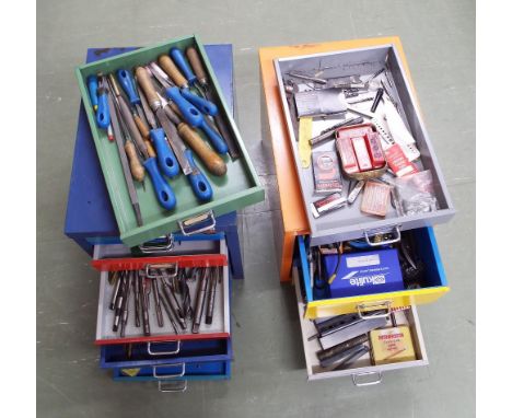 Two metal chests containing a large assortment of clock related tools including taps and dies, drill bits, files etc