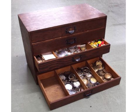 Stained wooden five drawer chest containing a quantity of watch movements, cases and spares, also a quantity of watch making 