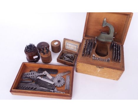 Swiss Star boxed staking set and accessories, further associated wooden cased tools and a selection of screw thread plates