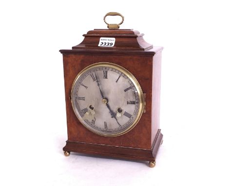 Small walnut two train mantel clock striking on a gong, the 5.5" silvered dial within a stepped case surmounted by a stepped 