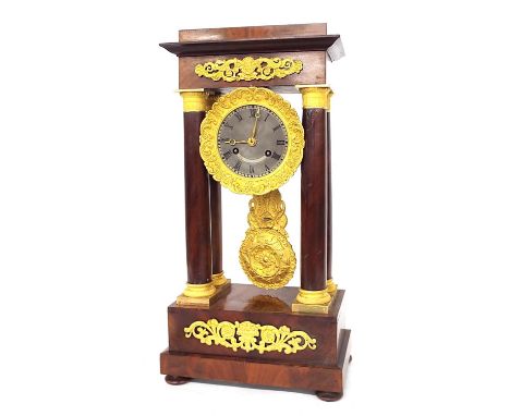 French mahogany and ormolu two train portico mantel clock, the movement with outside countwheel striking on a bell, the 3.5" 