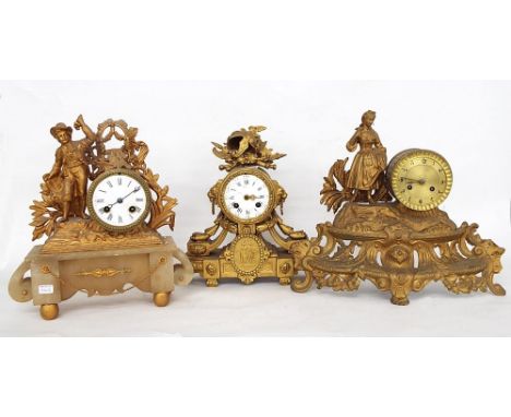 Three various gilded spelter two train mantel clock timepieces in need of restoration, tallest 12" high (two with pendulums) 