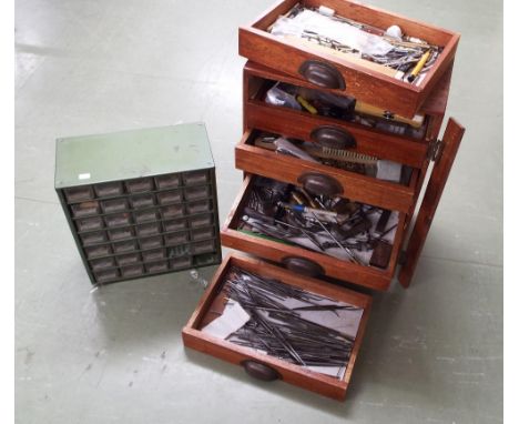 Wooden eight drawer watch/clockmakers chest containing a large quantity of assorted tools and fittings including taps and die