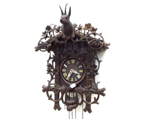 Black Forest three train cuckoo and quail wall clock, the 5.25" dial within a chalet case applied with flowering foliage and 