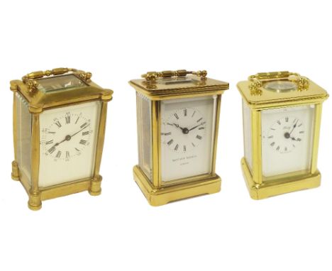 Carriage clock timepiece, the dial signed Matthew Norman, London within a corniche brass case, 5.75" high; together with two 