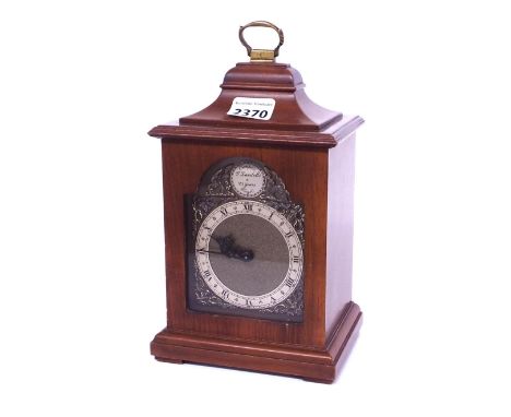 Rotherham contemporary mahogany small bracket clock, the 3.25" brass arched dial surmounted by a caddy top and brass carrying