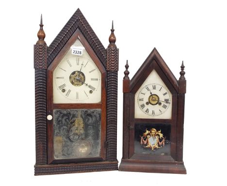 American rosewood two train alarm mantel clock striking on a gong and a bell, within a carved steeple case, 20" high; also a 