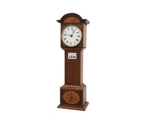 Novelty mantel clock timepiece modelled as a longcase clock, the 2.75" white dial within a satinwood inlaid case, 13.5" high