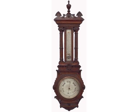Carved oak wall barometer/thermometer, the 8" silvered dial signed T & H Doublet, 11 Moorgate Street, London, within an archi