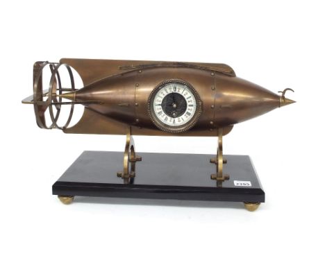 Contemporary reproduction single fusee novelty mantel clock, the 3.25" dial within a brass torpedo shaped case upon a black s