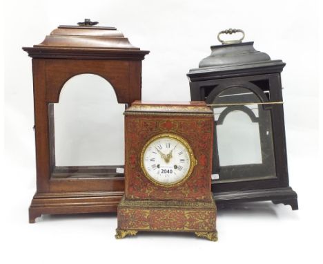 Good mahogany bracket clock case with aperture for an 8" arched dial, surmounted by a stepped caddy top and brass carrying ha
