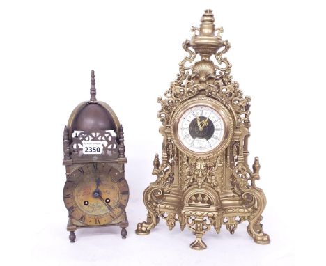 Brass two train lantern clock, the 4.5" chapter ring enclosing an engraved centre, surmounted by pierced engraved side frets 