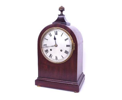 Mahogany two train mantel clock, the W&H movement striking on a gong, the 6" silvered dial within a rounded arched stepped ca