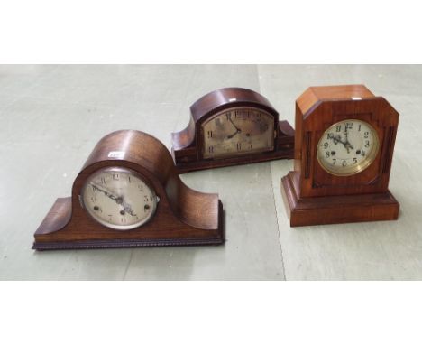 Oak three train Napoleon hat mantel clock, the 5.5" silvered dial signed James Walker, Ltd, 9" high; together with two furthe