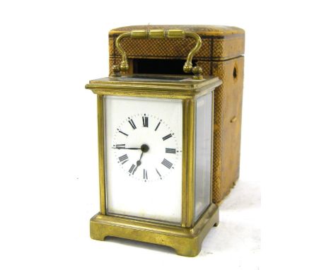 Carriage clock timepiece within a corniche brass case, 5.5" high; with a Morocco leather travelling case