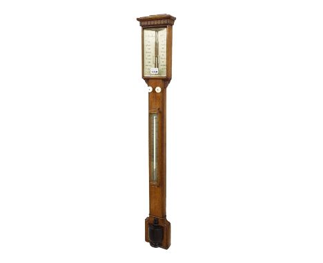 Oak stick barometer, the silvered angled scale signed H. Wadham, Bath over a flat trunk fitted with a thermometer and ebonise