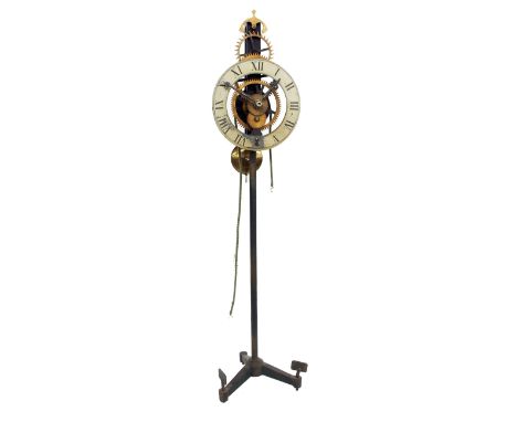 Small turret movement with 8" chapter ring upon an iron stand, 34" high