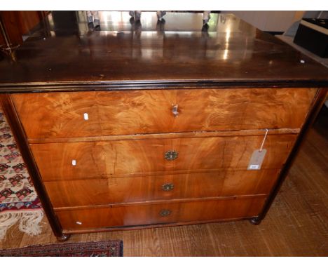 A 19th century walnut and ebonised Biedermeier style secretaire chest, the rectangular moulded top above a secretaire drawer 