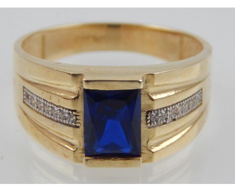 A gentleman's 14ct yellow gold sapphire and diamond dress ring.