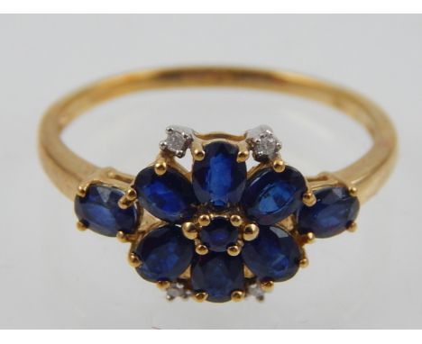 A 9ct yellow gold, sapphire and diamond flower head cluster dress ring