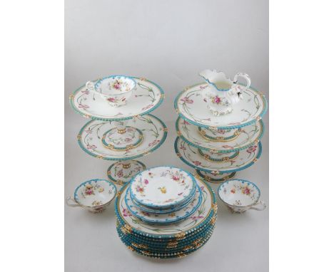 A late 19th century desert service floral decorated with a turquoise 'jeweled' rim, comprising nine side plates and four foot