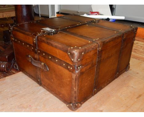 A Victorian style brass studded tan leather trunk, with twin hinged top. W. 72cm