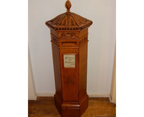 A late Victorian Irish penfold pattern oak internal postbox by Strahan & Co, Henry St. Dublin, of hexagonal form with carved 