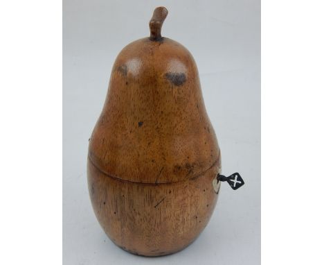 A novelty fruitwood tea caddy modelled as a pear. H. 18cm