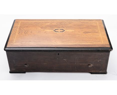 A Swiss rosewood cased musical box, third quarter 19th century; the hinged cover with foliate marquetry and line inlay; the c