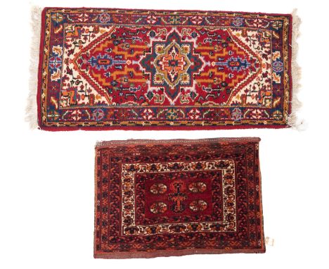 A Turkoman saddle bag, the madder field with four quartered octagons, enclosed by a geometric border, 80cm x 56cm, also a sma